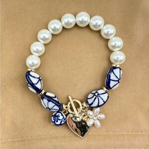 New never worn Elegant Pearl and Blue Bead Bracelet heart and flower charms